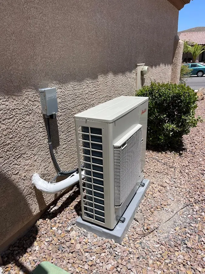 Residential air conditioning condenser unit in Cushing
